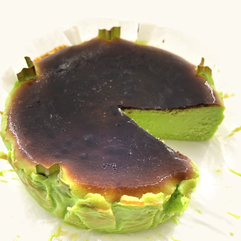 Pandan Burnt Cheesecake cut open, bright green inside
